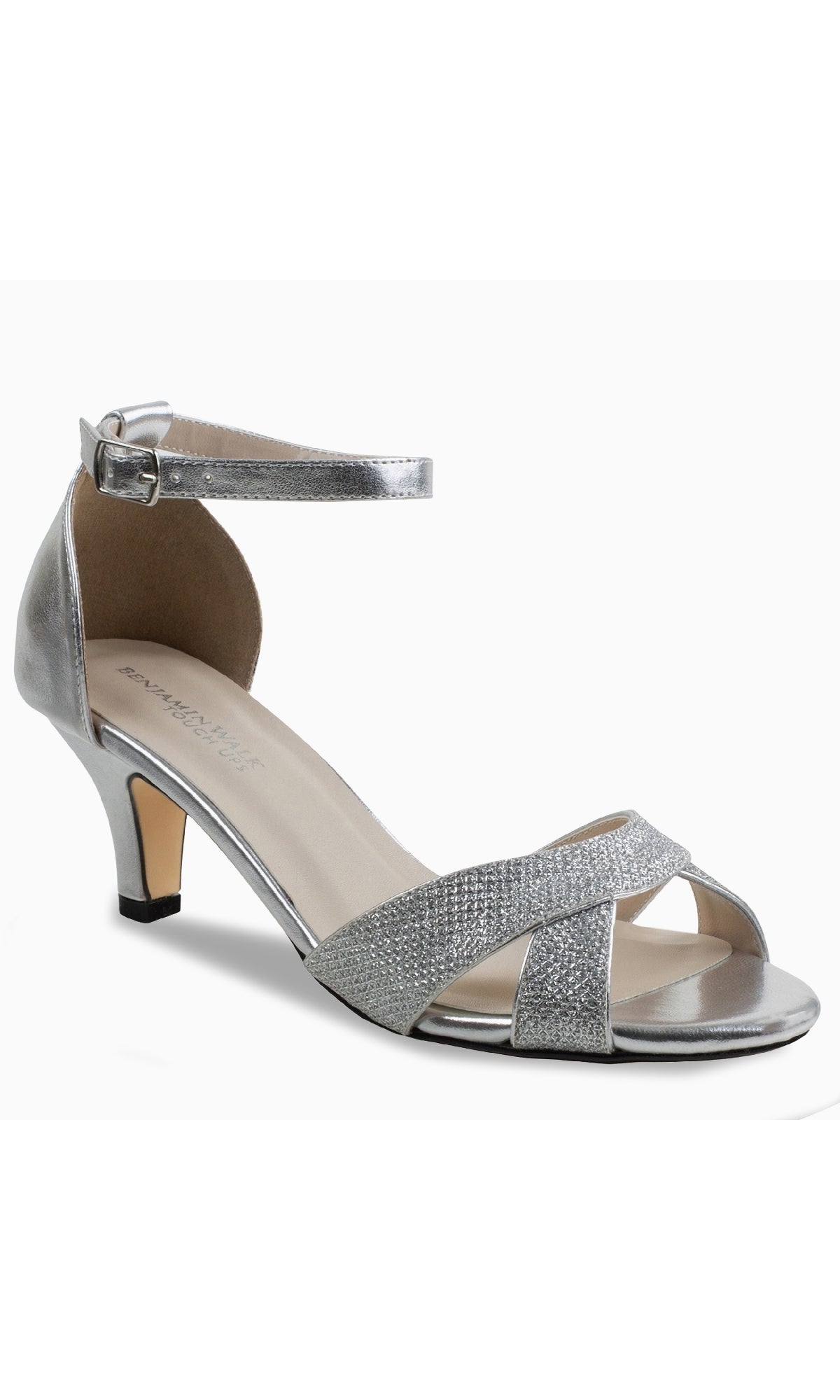 The Clementine Silver Glitter Prom Shoes by Touch Ups 4613 feature an open toe, low kitten heel, crisscross front straps, and a buckle ankle strap—ideal for a comfortable yet elegant prom look.